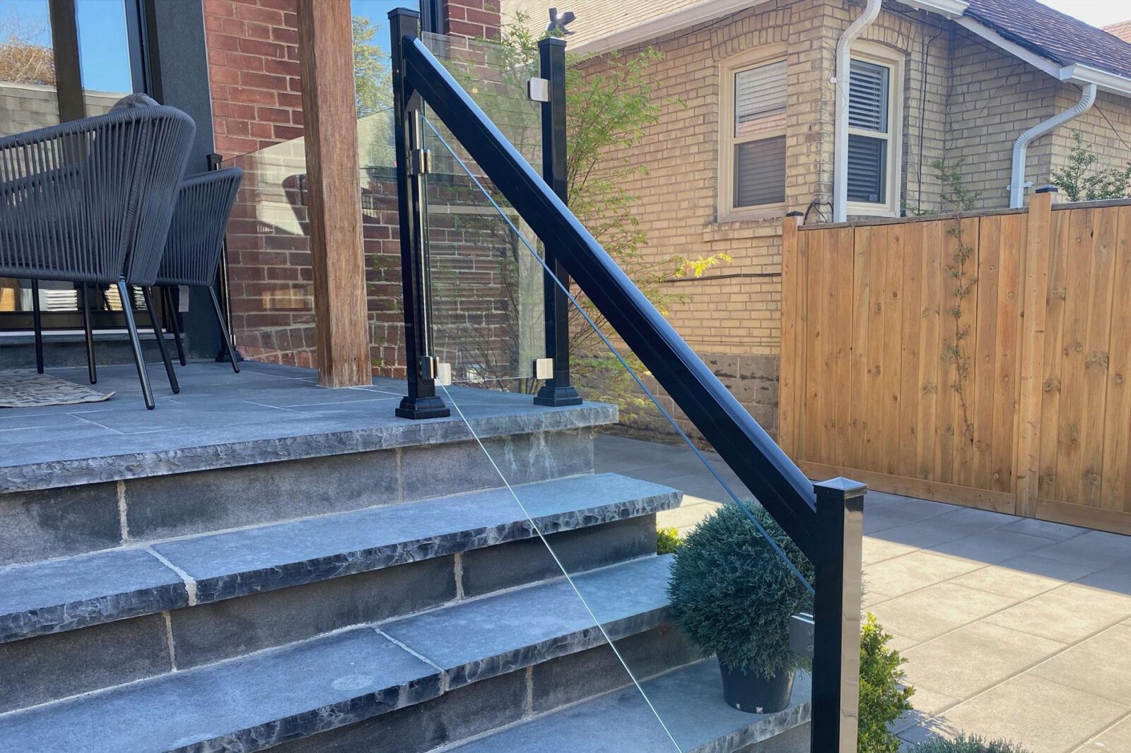 frameless glass railing with handrail