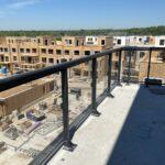 glass railing on balcony of a new construction site in Mississauga