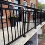 black aluminum railing on front deck in downtown toronto