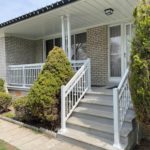 white porch railing with decorative scroll