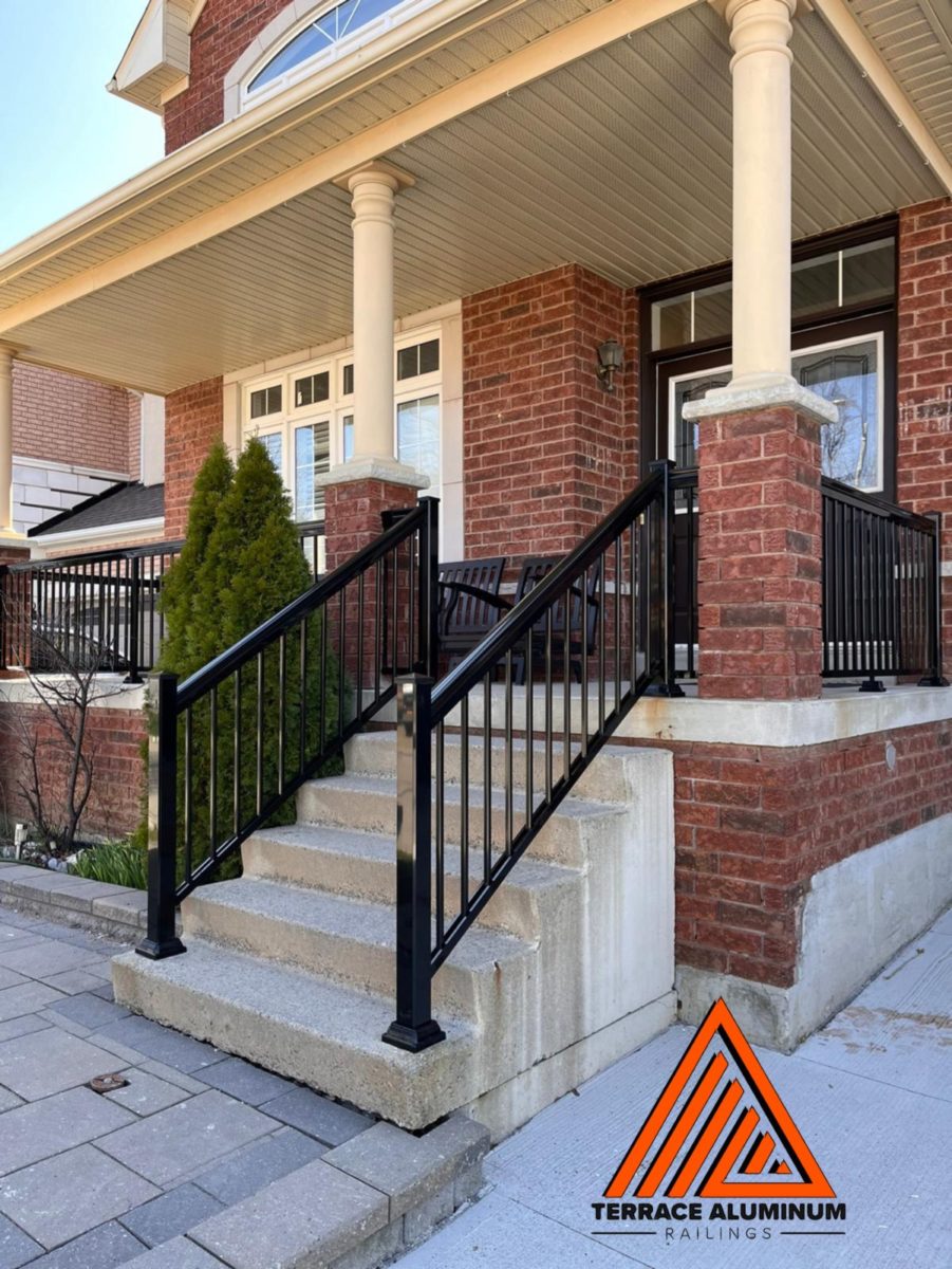 exterior aluminum railings in black colour on a red brick house