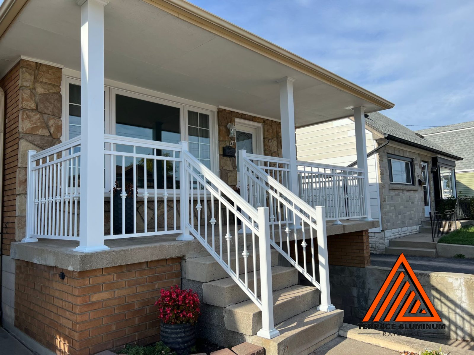 white aluminum railing with aluminum columns above a garage for a front porch