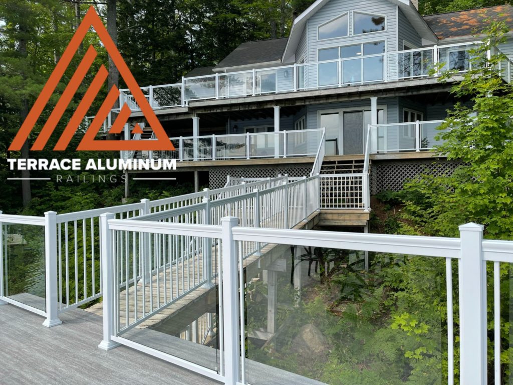 white aluminum railing at a cottage with 2 levels of balconies