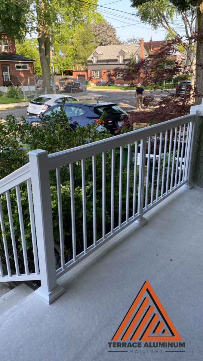 inside view of a porch with white aluminum railing