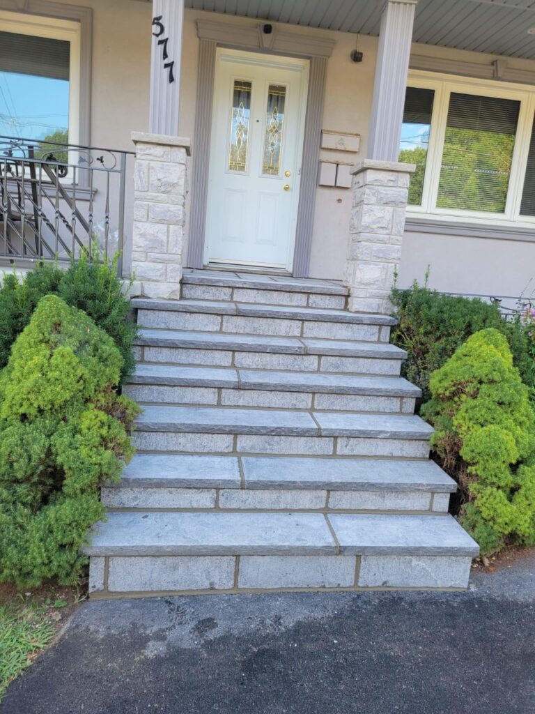 Flagstone porch and walkway in Toronto by Terrace Aluminum Railings & Masonry.