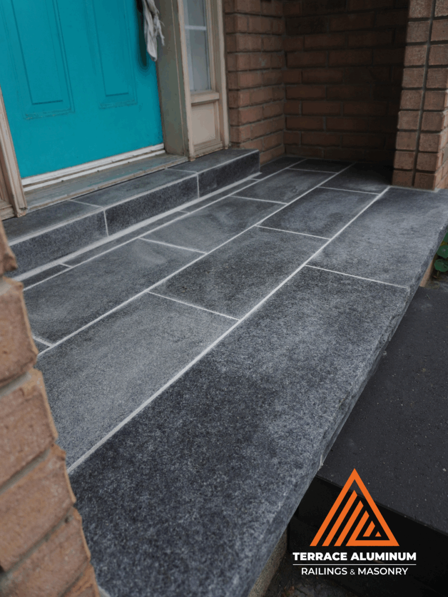 Front porch flagstone installed over existing concrete base with a premium natural stone finish.