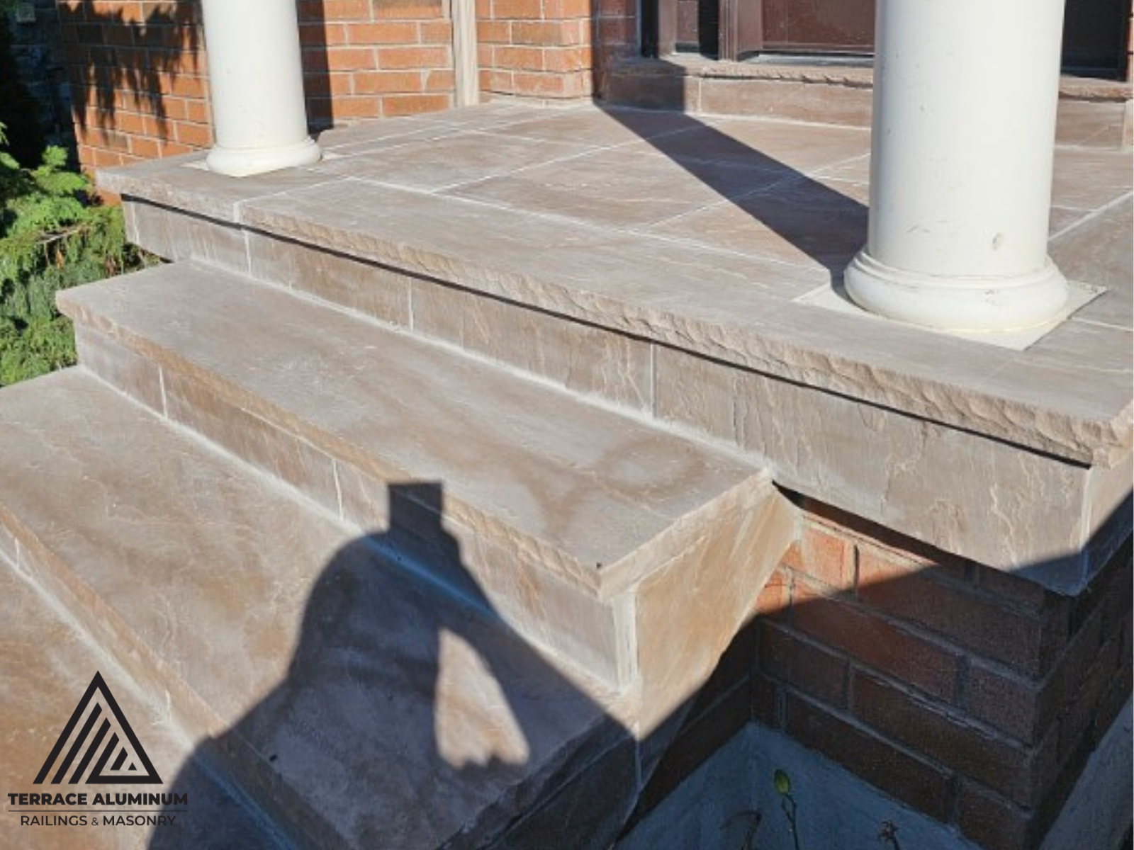 Custom flagstone walkway and porch in Oakville residence.