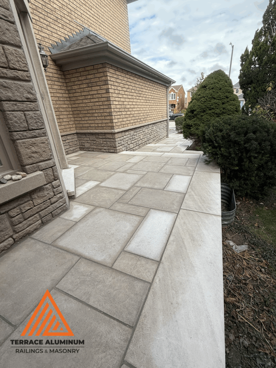 Flagstone patio and walkway installation in Oakville backyard.