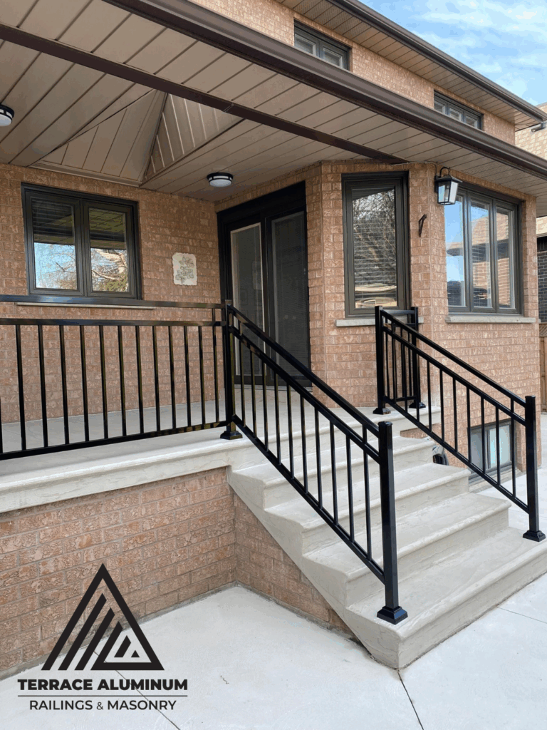 R12 Open aluminum railings installed on a front porch in Toronto by Terrace Aluminum Railings & Masonry.
