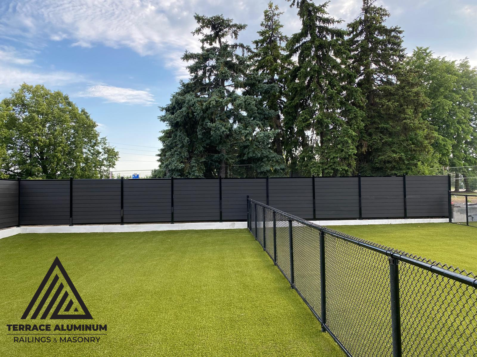 Composite fence gate with matching horizontal boards and black frame