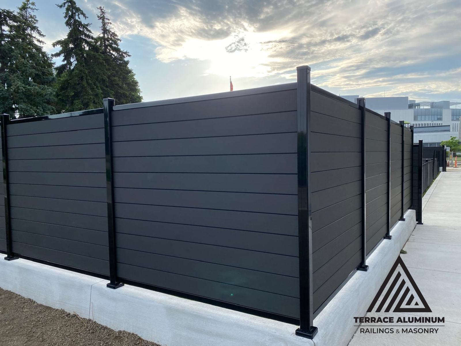 Composite fence panels assembled with sleek aluminum framing