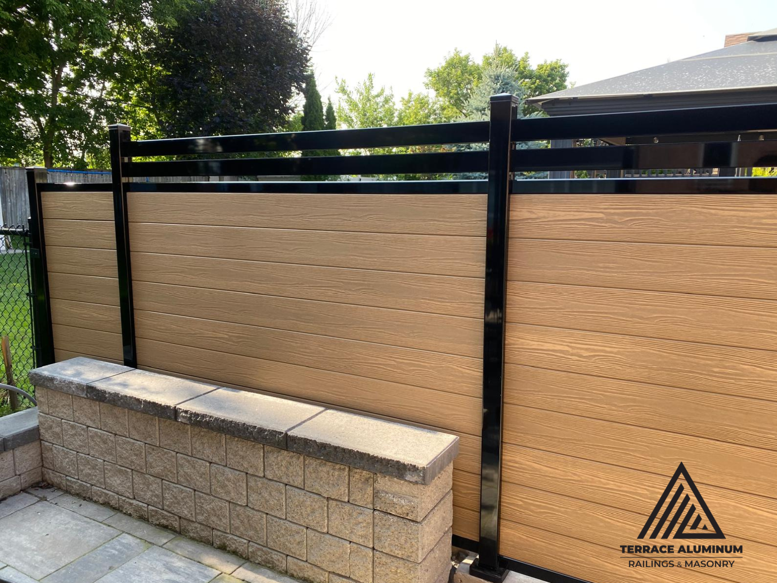 Close-up of composite fence boards showing realistic wood texture