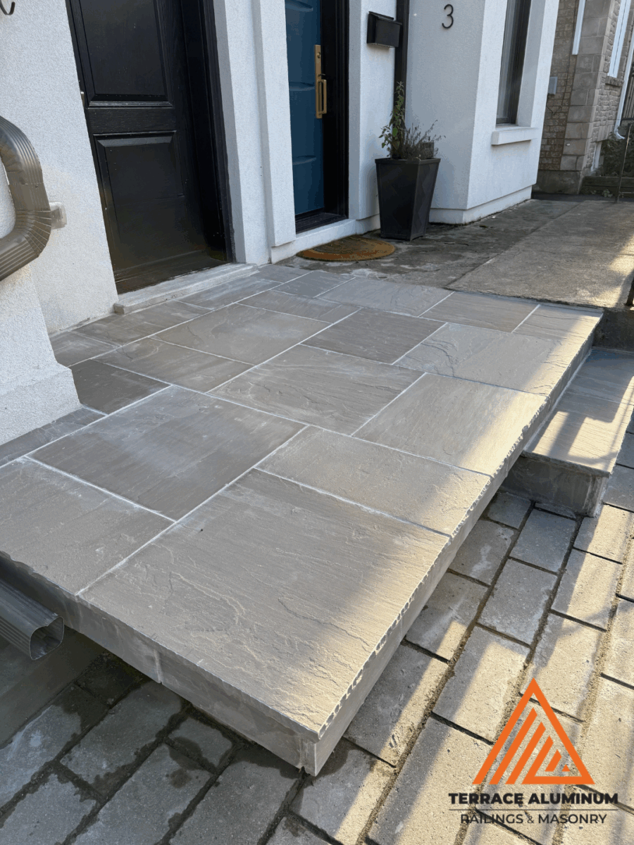 Natural flagstone surface showing unique stone patterns and color tones