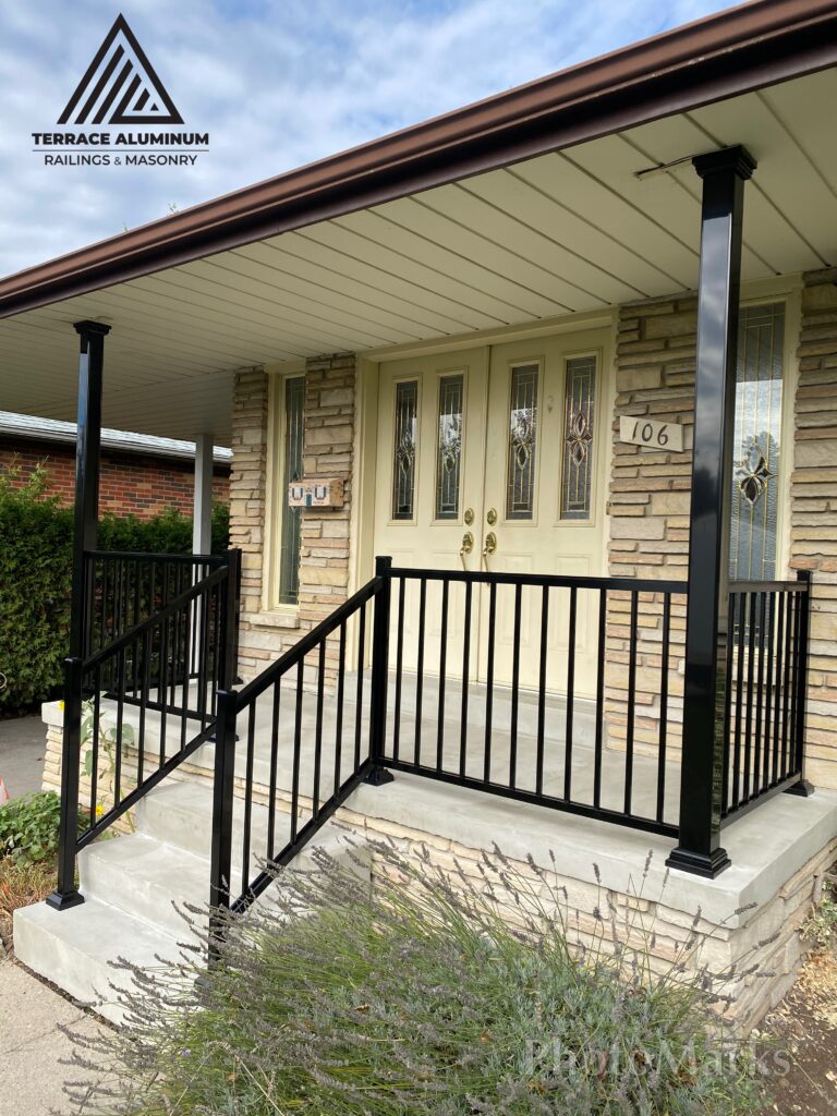 Freshly parged front porch with new aluminum railing and 4x4 columns in Toronto.