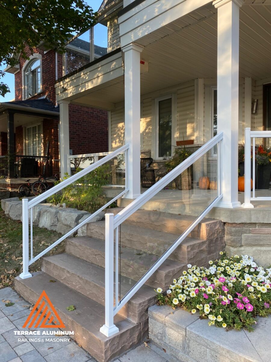 Aluminum glass railings on flagstone porch steps in Toronto.