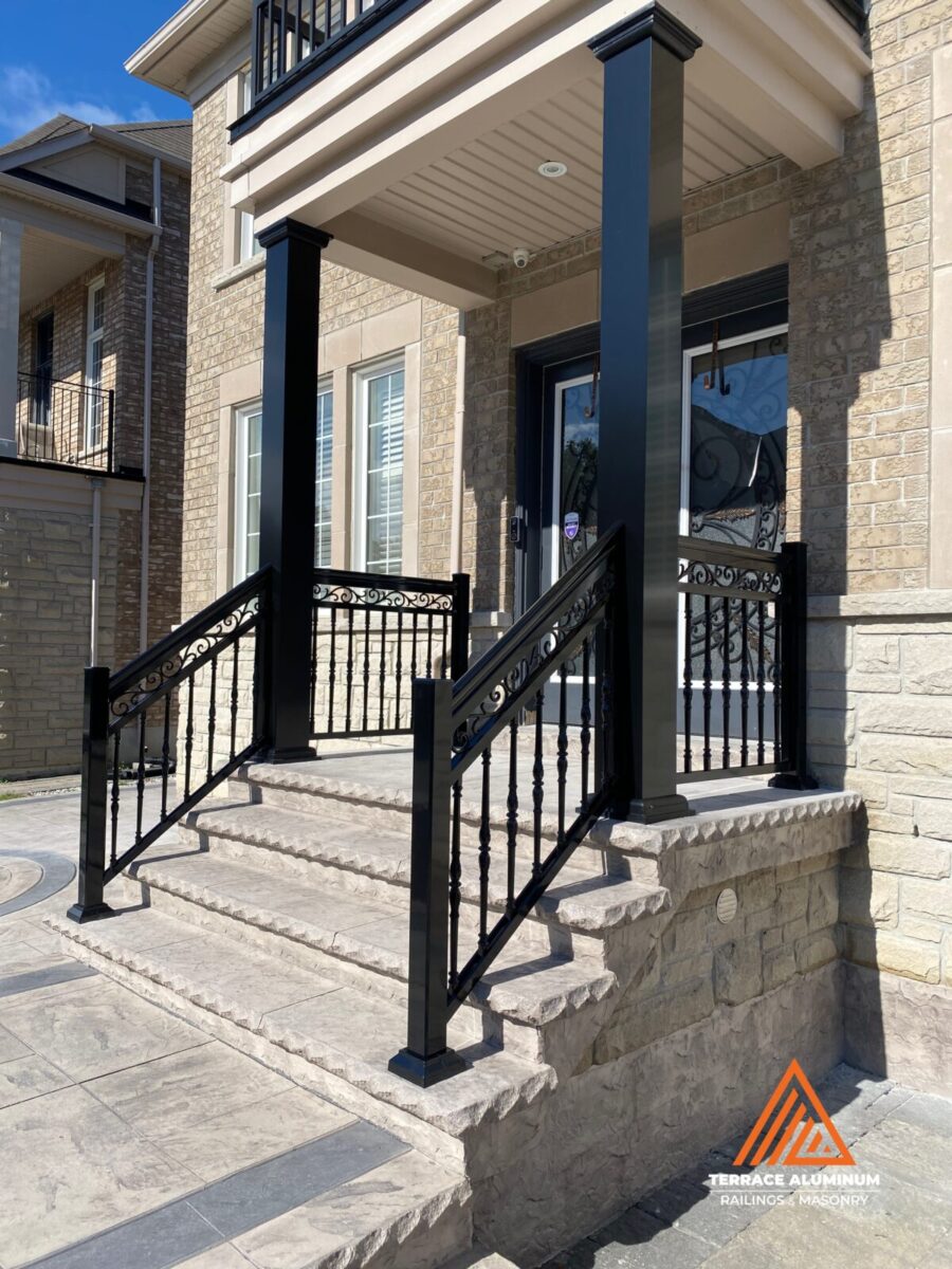 Aluminum railings with decorative columns on a front porch in Toronto by Terrace Aluminum Railings & Masonry.