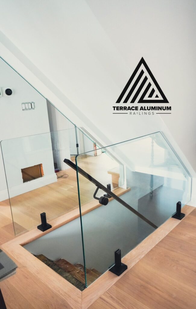 alt="Interior glass railings Toronto showcasing frameless glass railings on a contemporary staircase in a modern home"