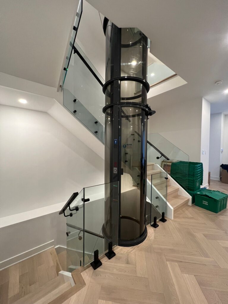 alt="Interior glass railings Toronto with frameless glass railings around a loft landing and staircase"