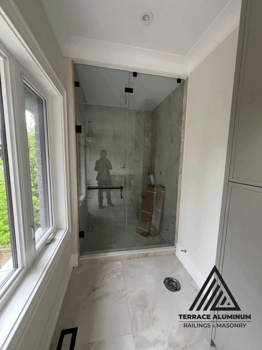 Shower glass with black frame and matte finish in Toronto bathroom