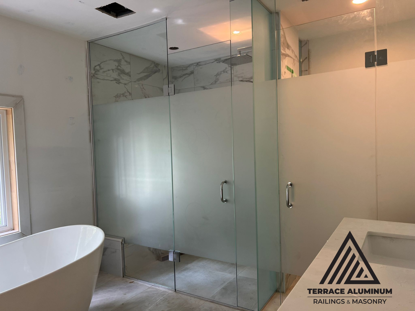 Tempered glass shower panels with seamless edges and clear finish