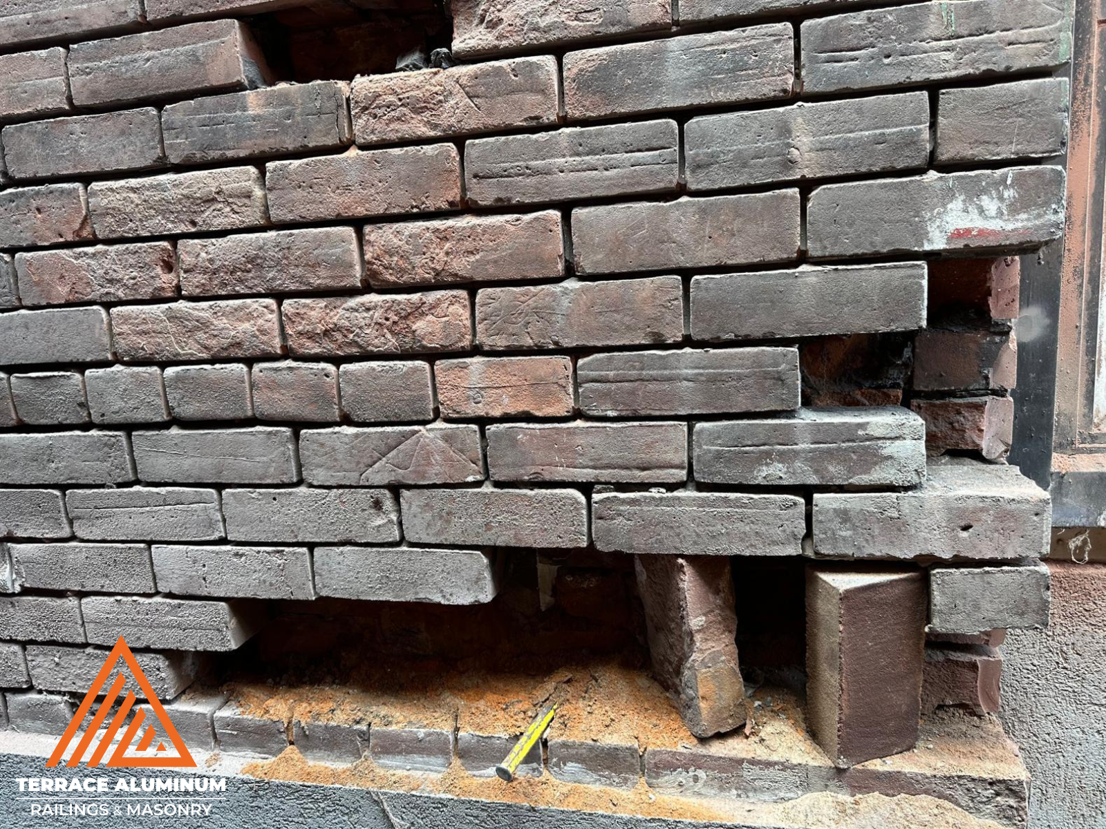 Brick restoration and repointing on porch wall in Toronto – Terrace Aluminum Railings & Masonry