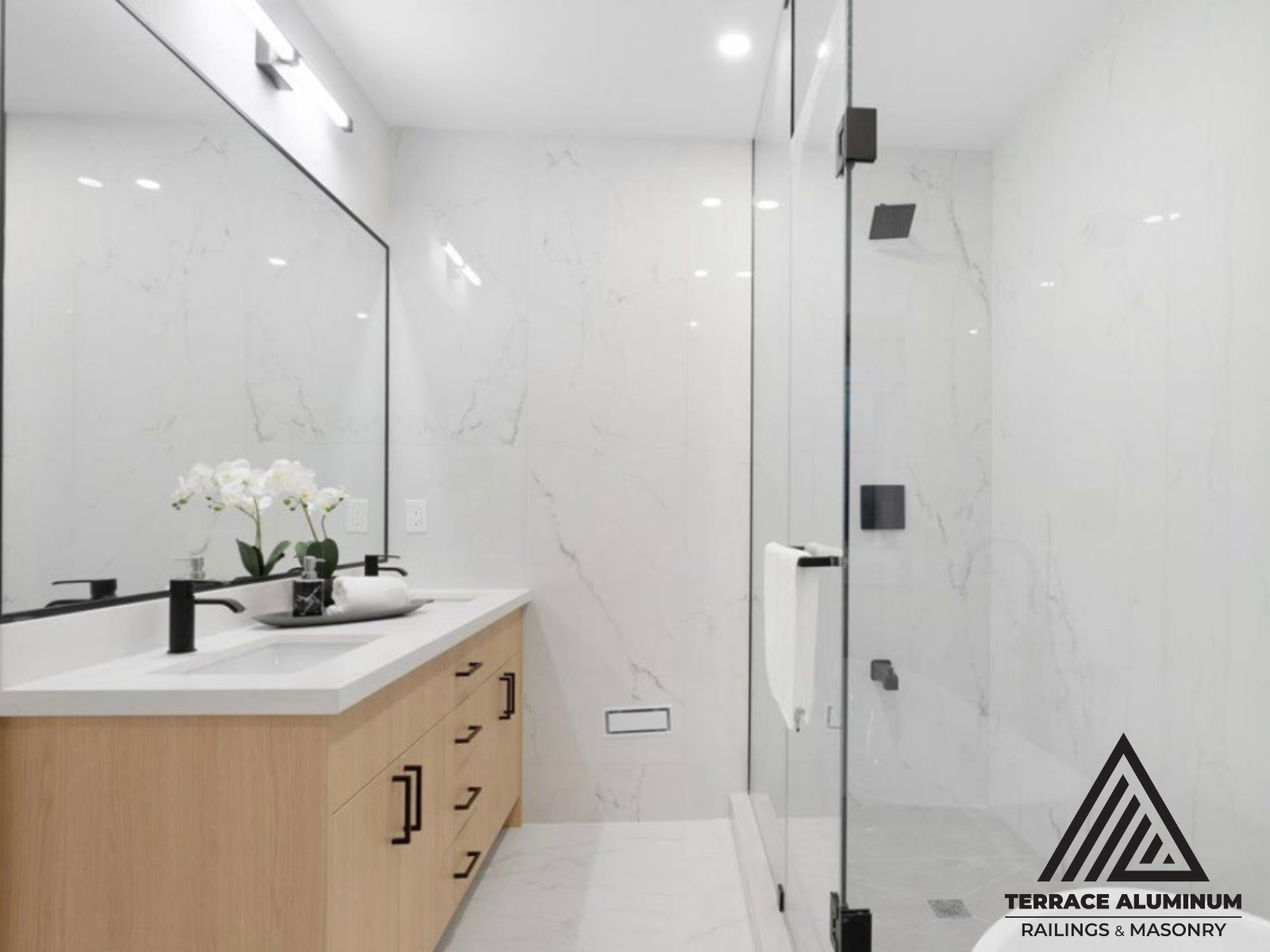 Frameless shower glass enclosure with stainless steel hardware in Toronto