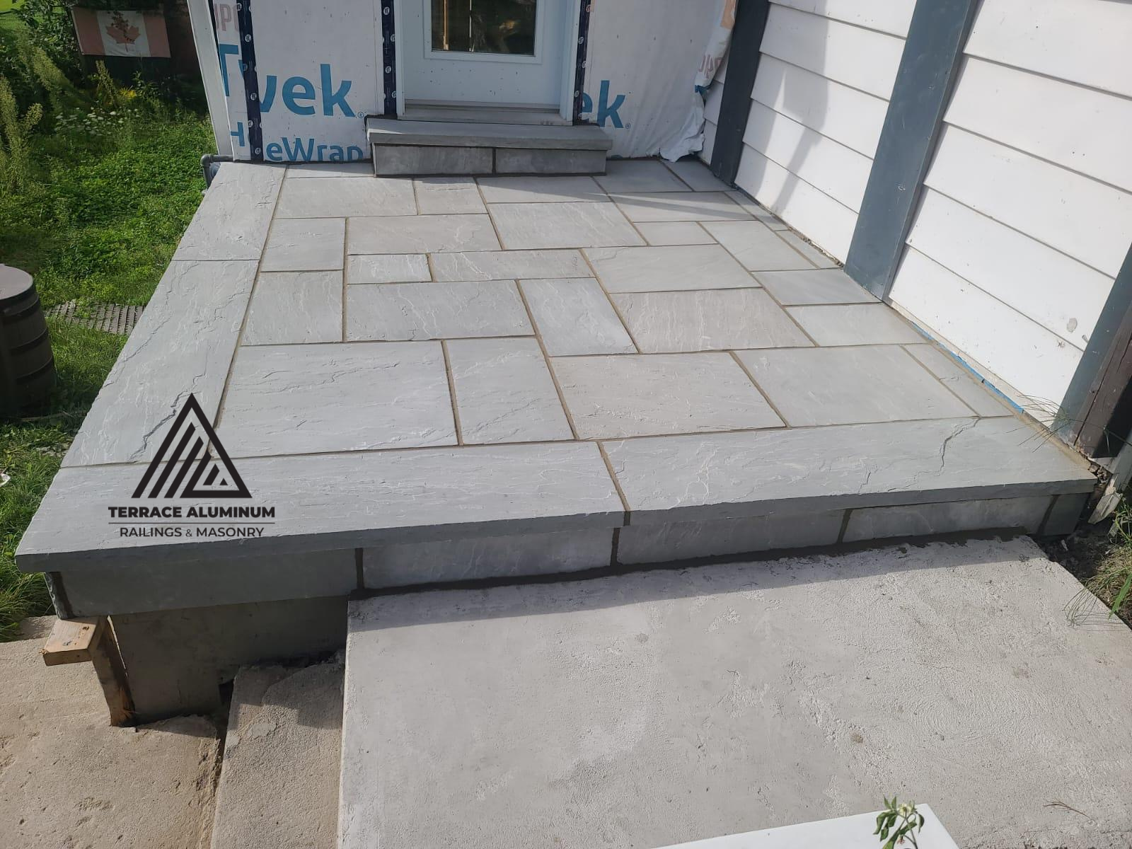 Flagstone porch and walkway combination with natural stone and clean finish
