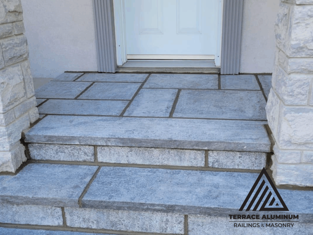Flagstone porch with matching natural stone steps in Toronto