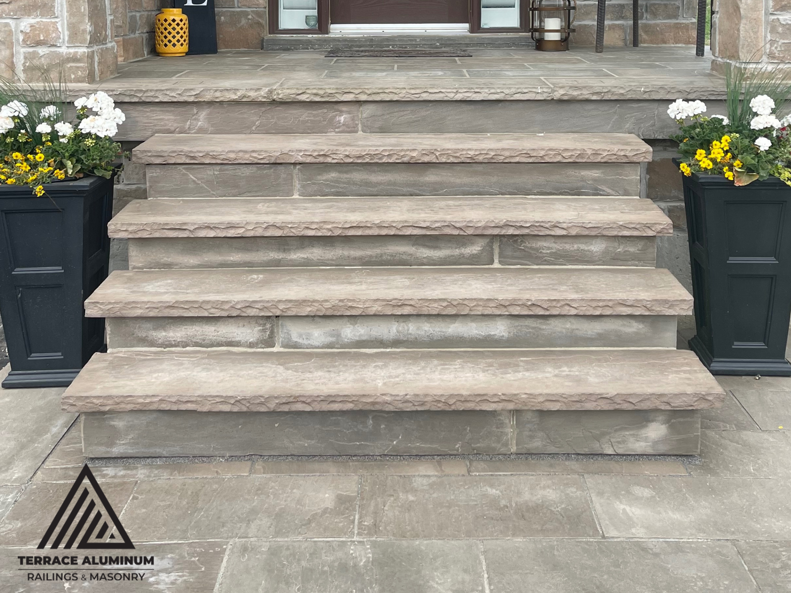 Front porch with natural flagstone steps installed