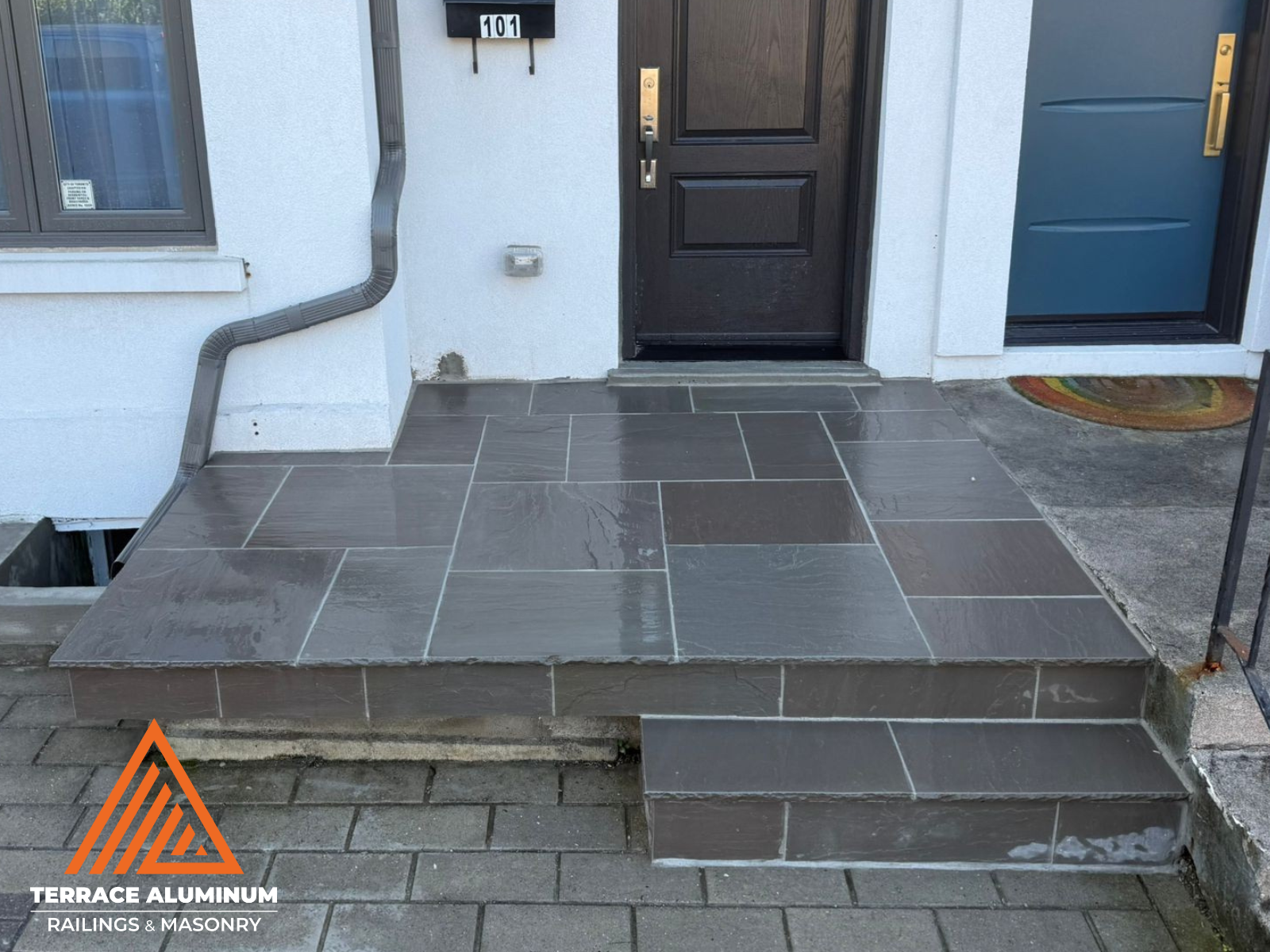 Skilled mason aligning flagstone slabs with precision