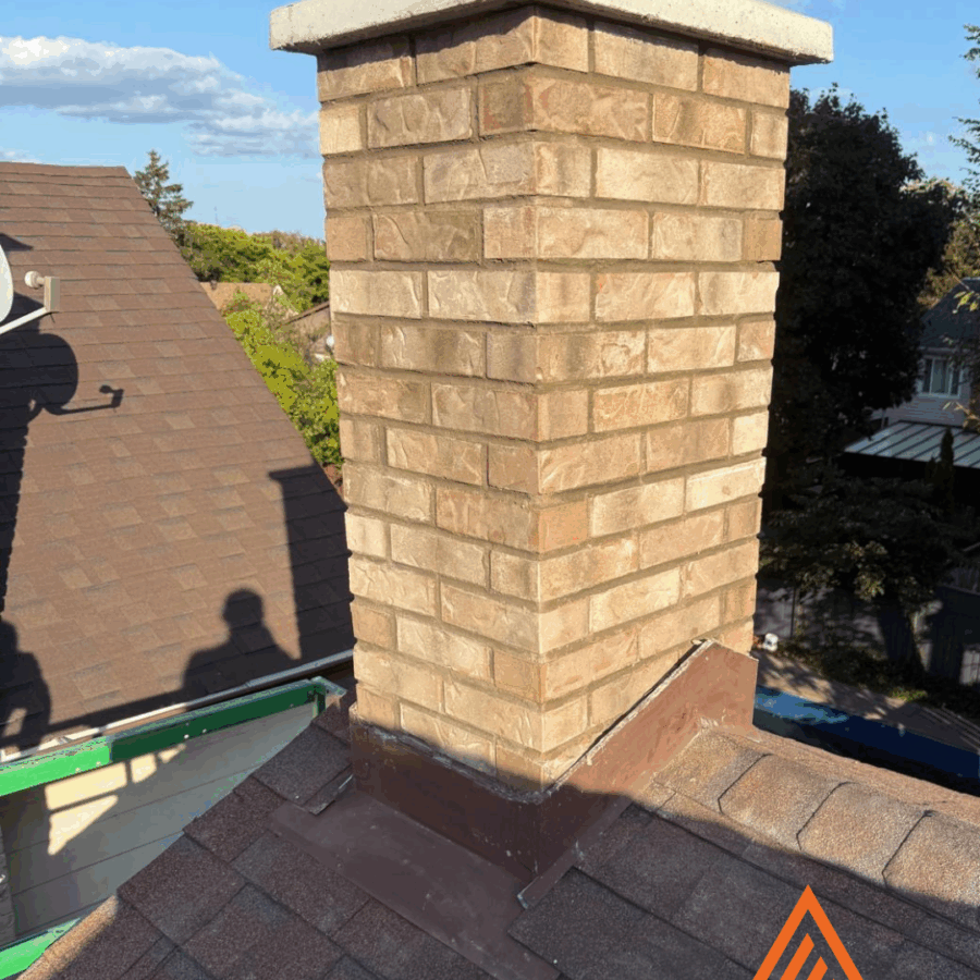 Newly repointed brick chimney in Toronto restored by Terrace Aluminum Railings and Masonry
