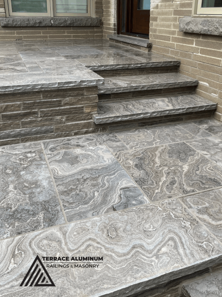 Flagstone porch and walkway in Toronto by Terrace Aluminum Railings & Masonry.