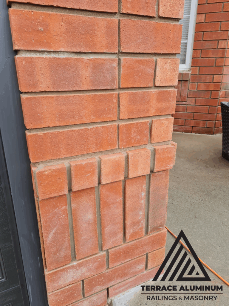 Repaired corner brick wall in Toronto with new matching mortar and restored bricks