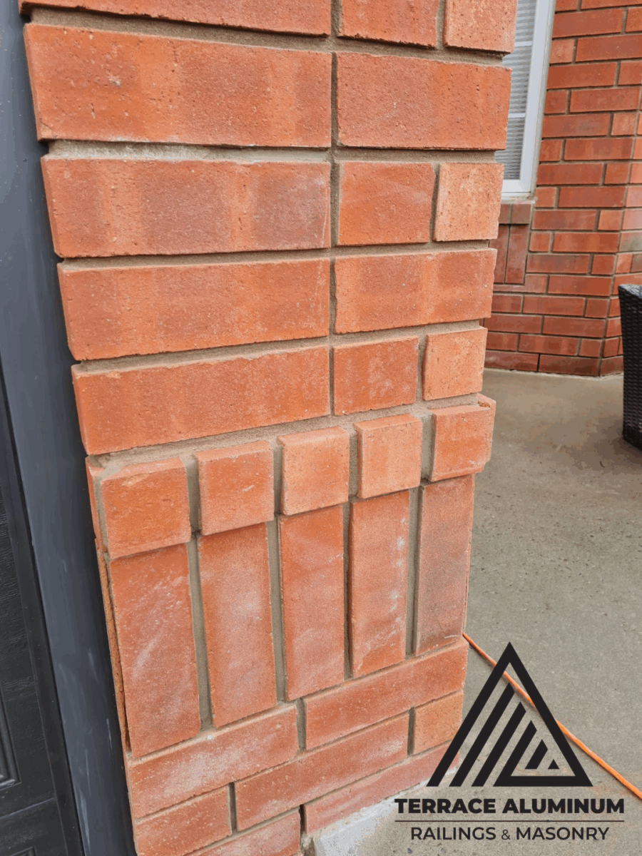 Repaired corner brick wall in Toronto with new matching mortar and restored bricks