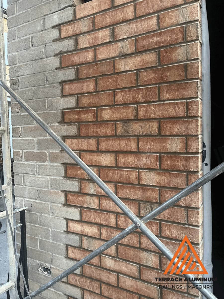 Exterior brick wall repair with fresh mortar joints in Toronto – Terrace Aluminum Railings & Masonry