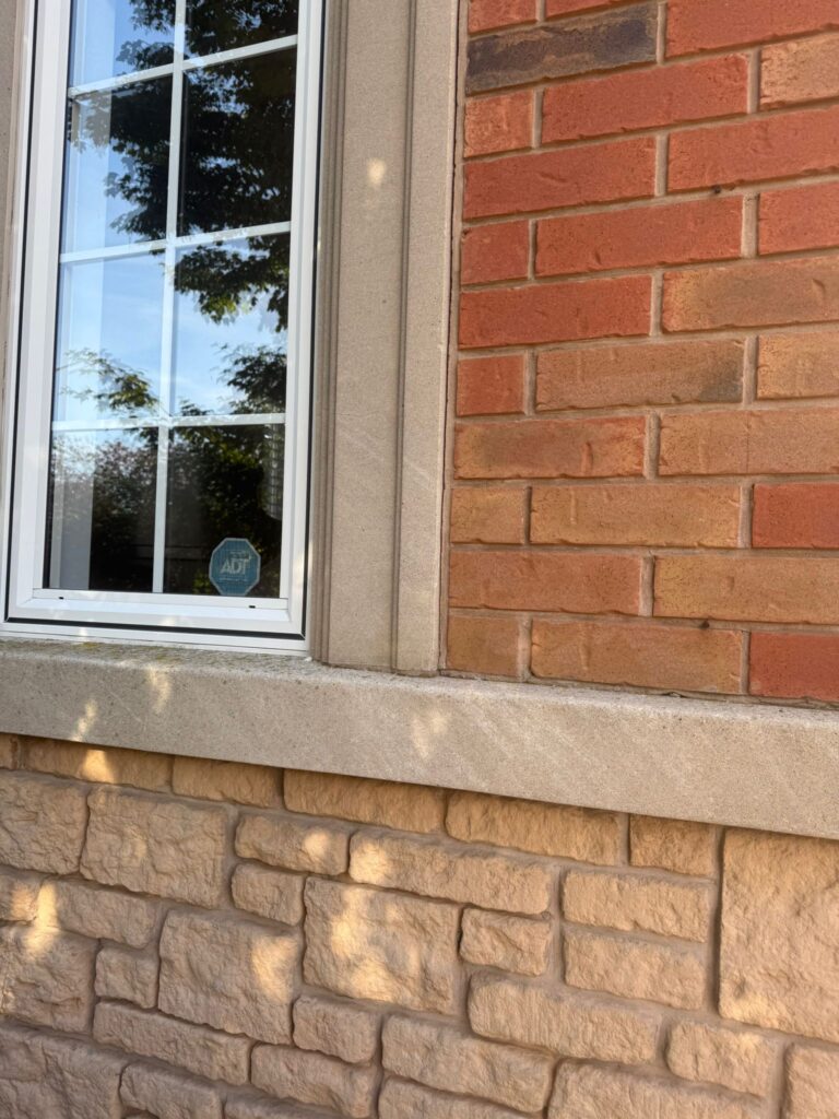 alt="Brick restoration in Hamilton showing before and after results with renewed mortar lines and matching brickwork"