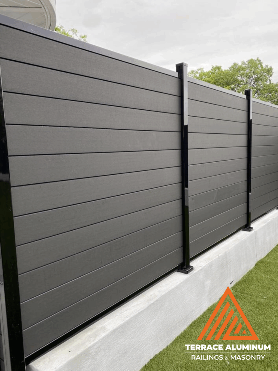Modern composite fence with slats installed in Toronto