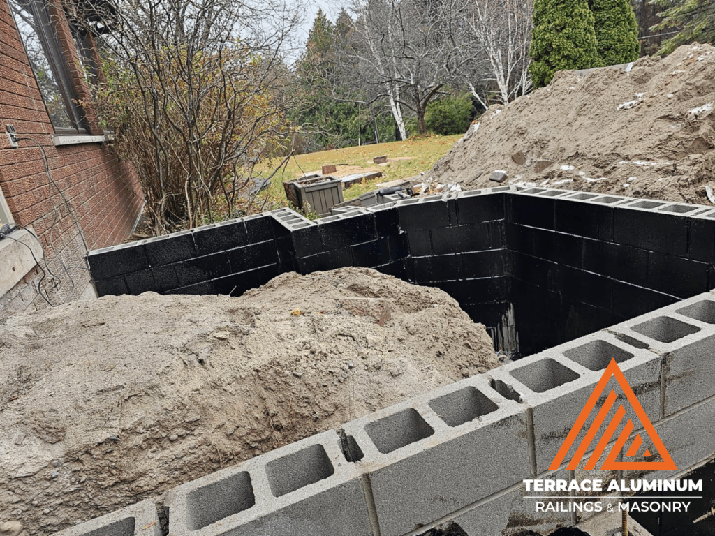Concrete being poured and leveled during residential project in Toronto