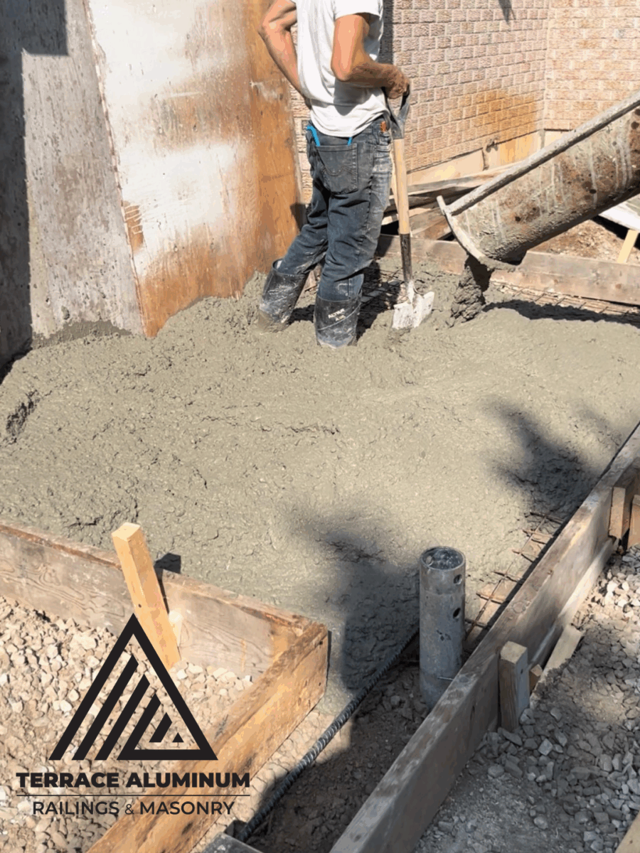 Forming and pouring new concrete foundation base in Toronto