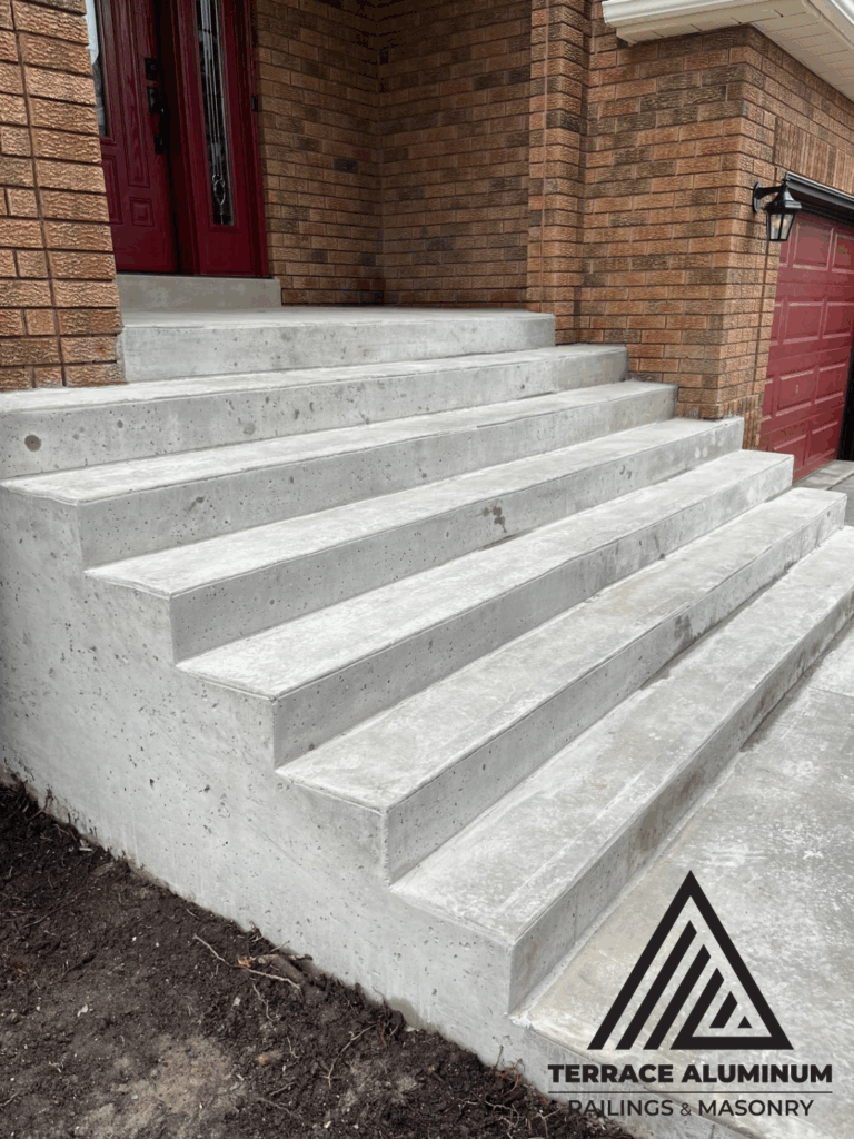 Concrete porch and steps in Toronto by Terrace Aluminum Railings & Masonry.
