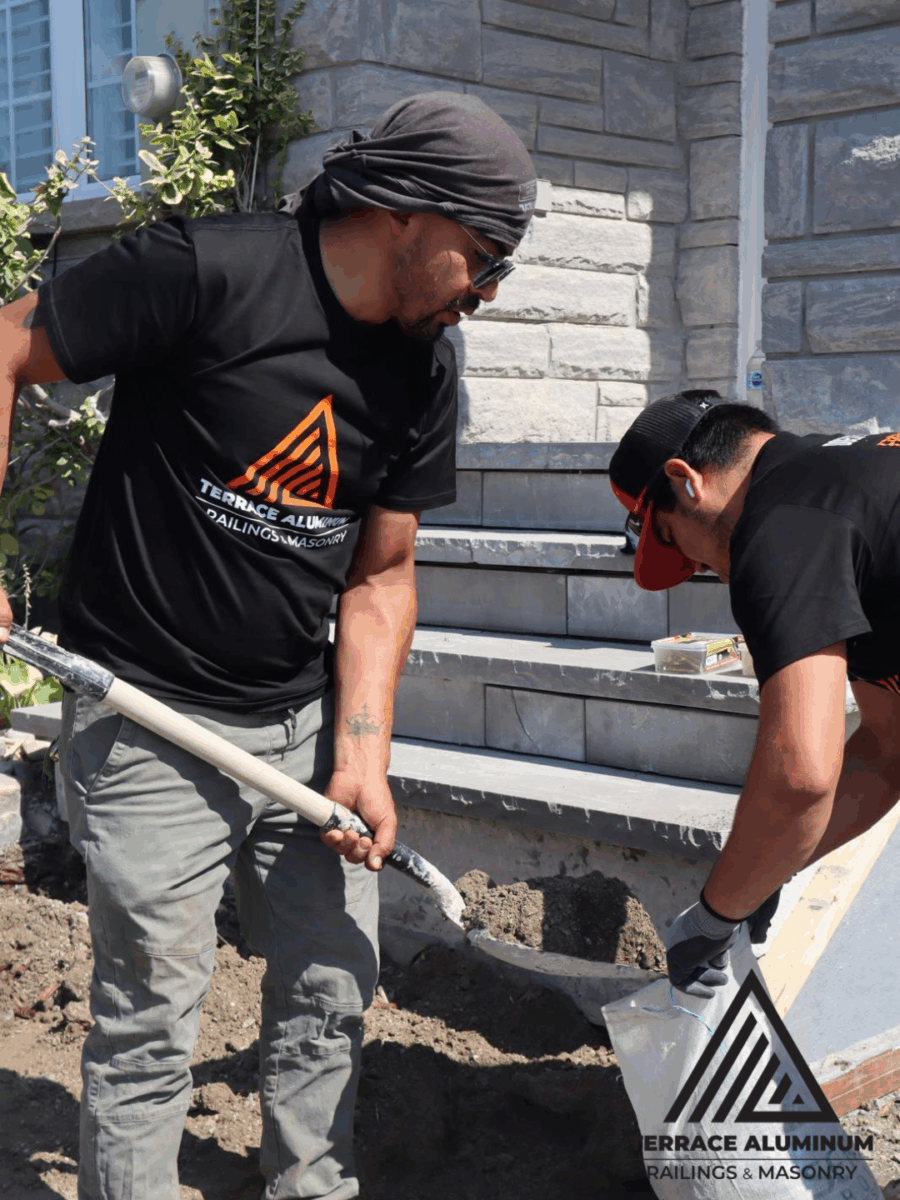 Concrete workers leveling freshly poured concrete on site