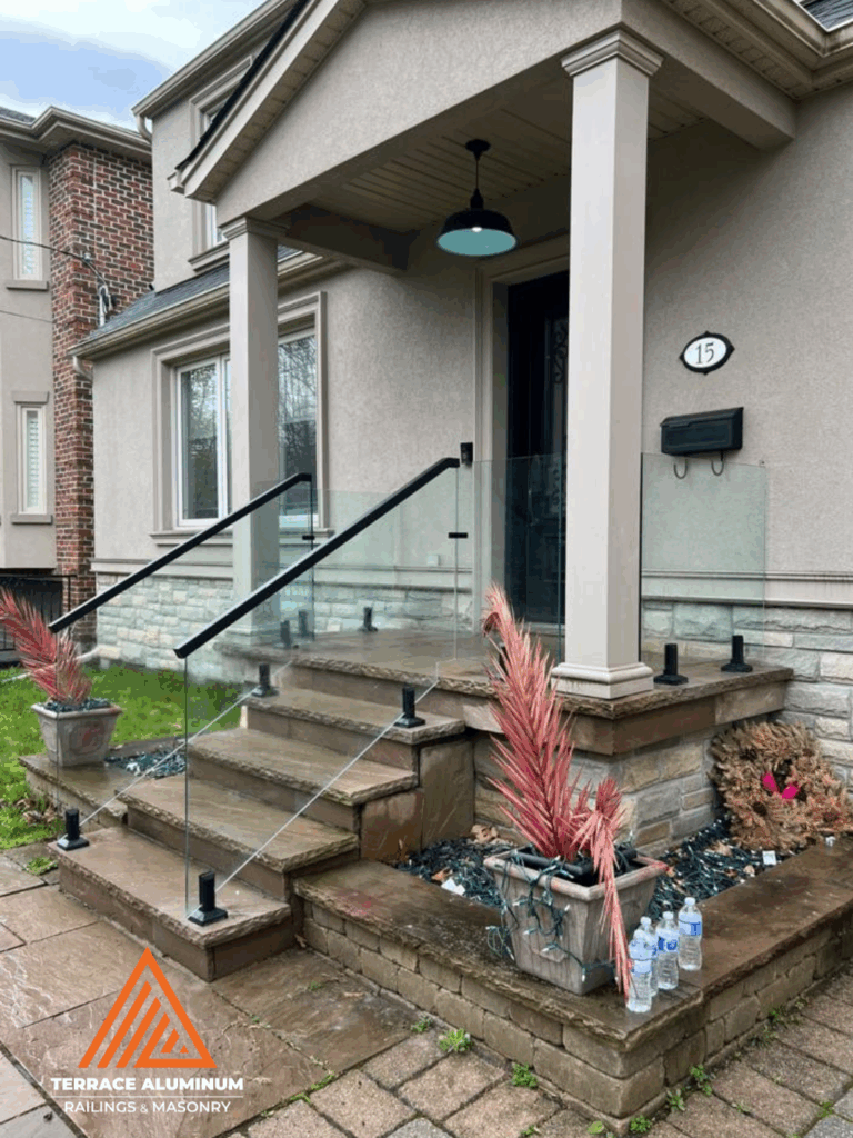 Frameless glass railings installed on a modern porch in Toronto by Terrace Aluminum Railings & Masonry.
