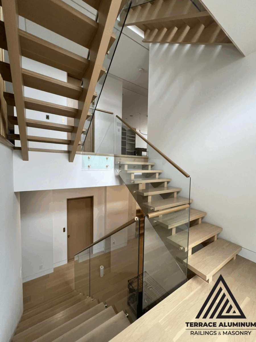 alt="Tempered glass staircase handrail installed by Terrace Aluminum Railings in Toronto"