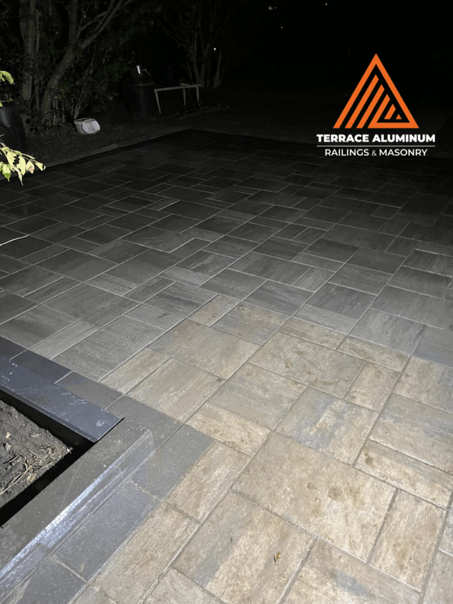 Modern interlock pattern using gray pavers on a backyard patio in Toronto