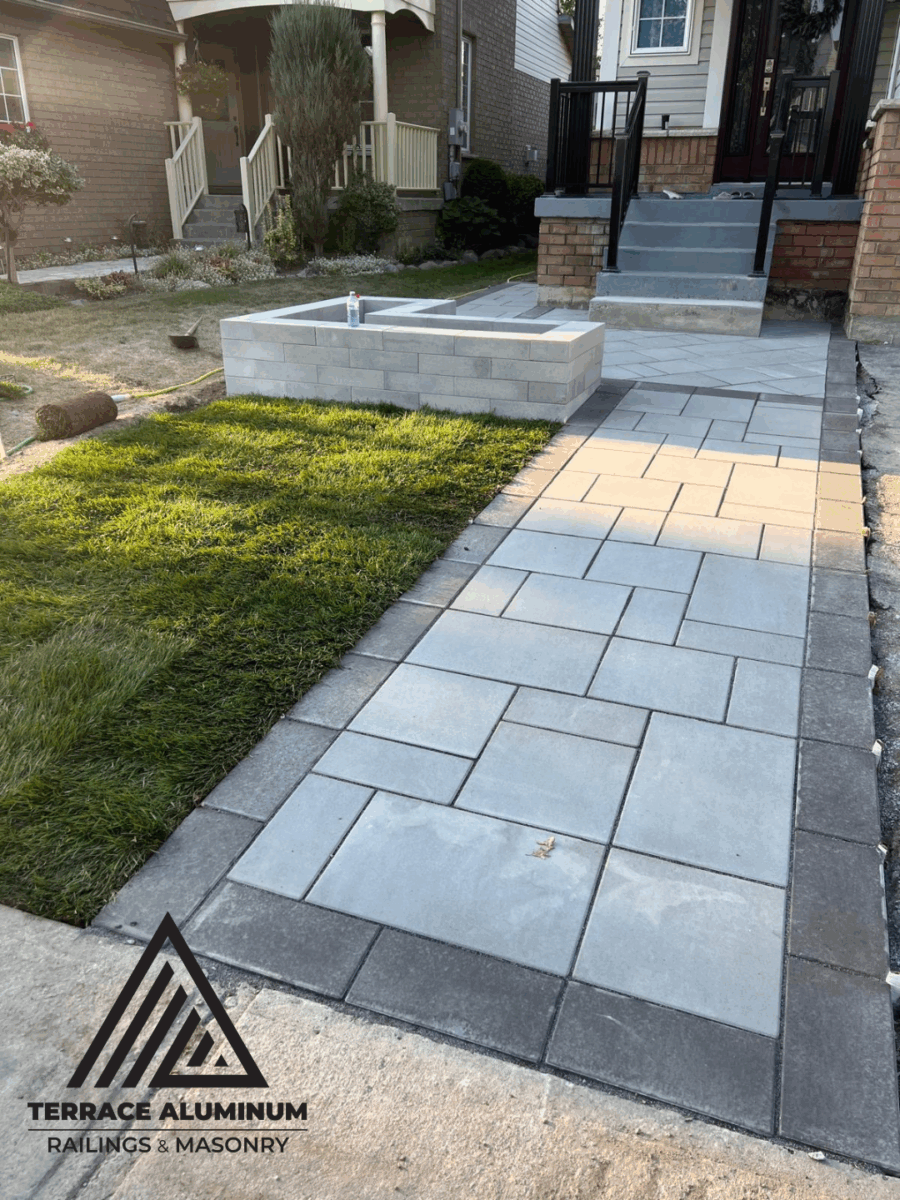Interlocking stone pathway connecting front porch to driveway in Toronto