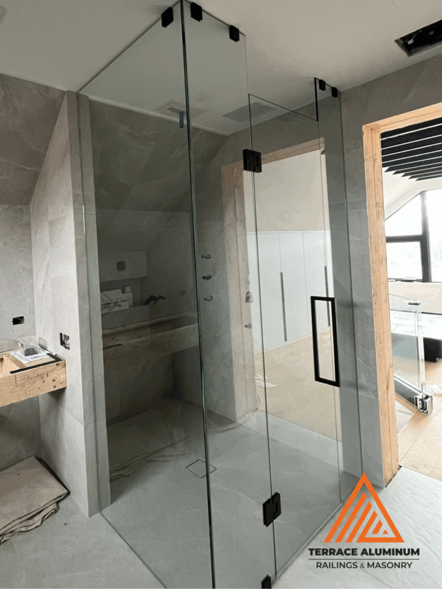 Shower glass panel installed with precision in modern bathroom