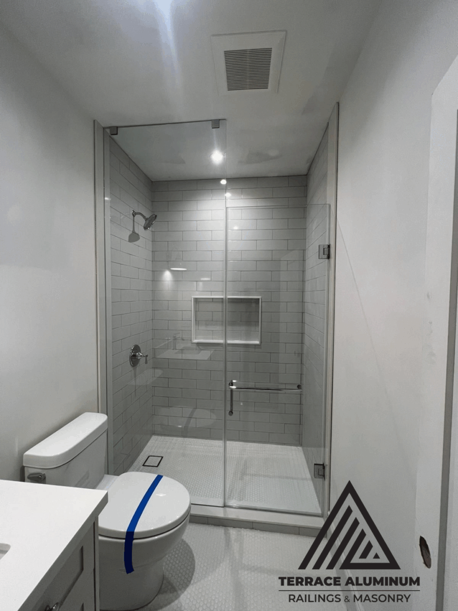 Frameless shower glass panels with seamless modern finish