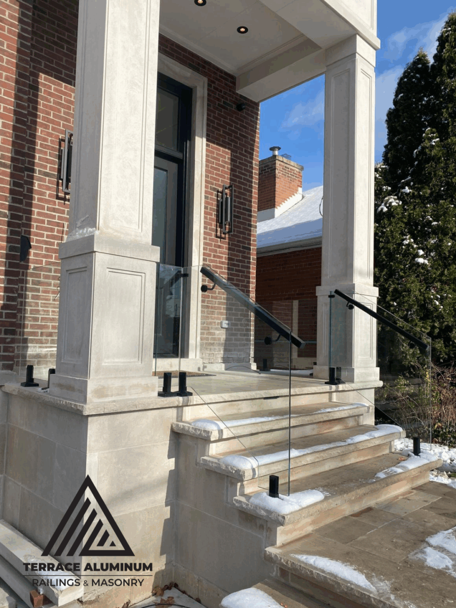 alt="Frameless staircase glass handrail with 12mm tempered glass panels and floating design in a Toronto residence"