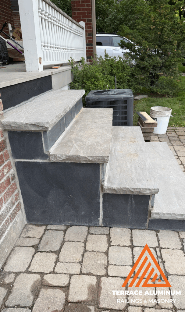 Full porch rebuild with new concrete steps and railings in Etobicoke