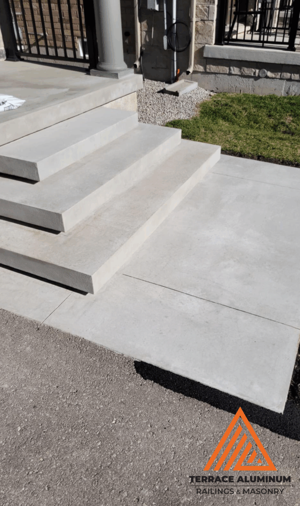 Close-up of cracked concrete step repair in Etobicoke